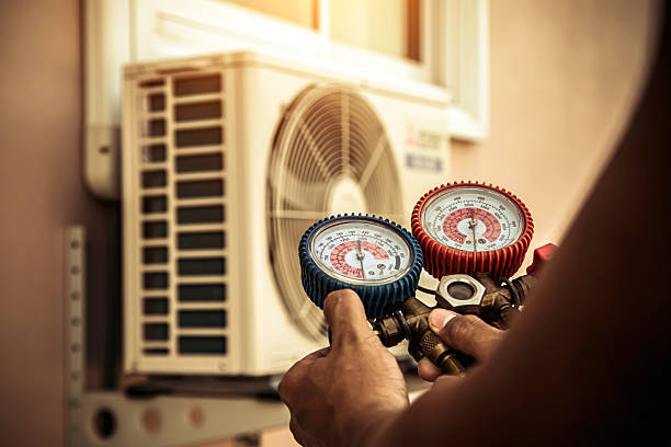 Professional Air Conditioning Service technician working in Rickreall, OR